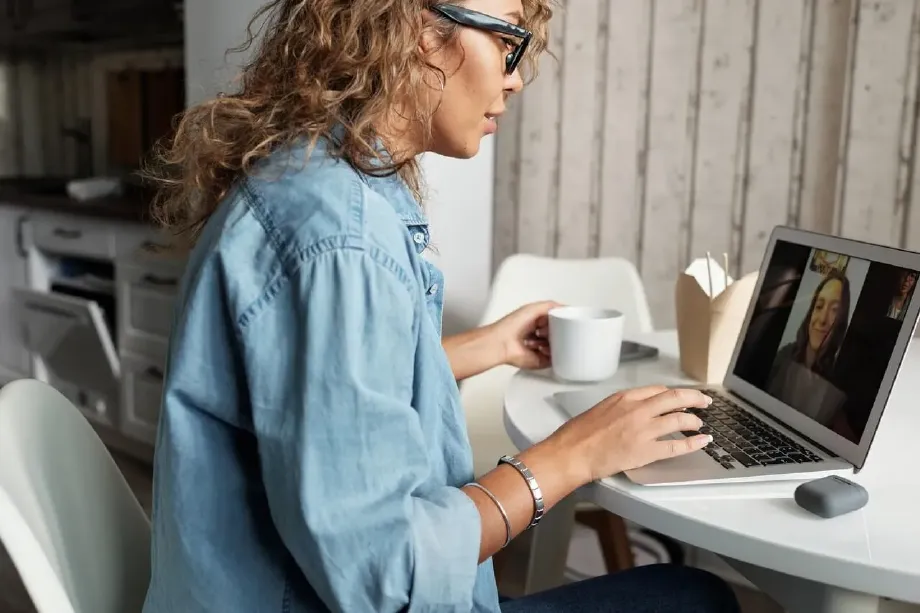 coach-on-a-video-call-at-table.webp